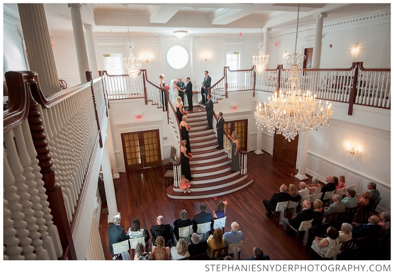 Bride and groom say their wedding vows on the staircase of the Ryan Nicholas Inn in Greenville, SC. Photographed by Stephanie Snyder Photography, a Greenville, SC wedding photographer.